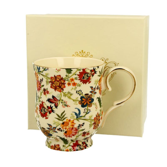 Tasse mit Goldrand und Blüten